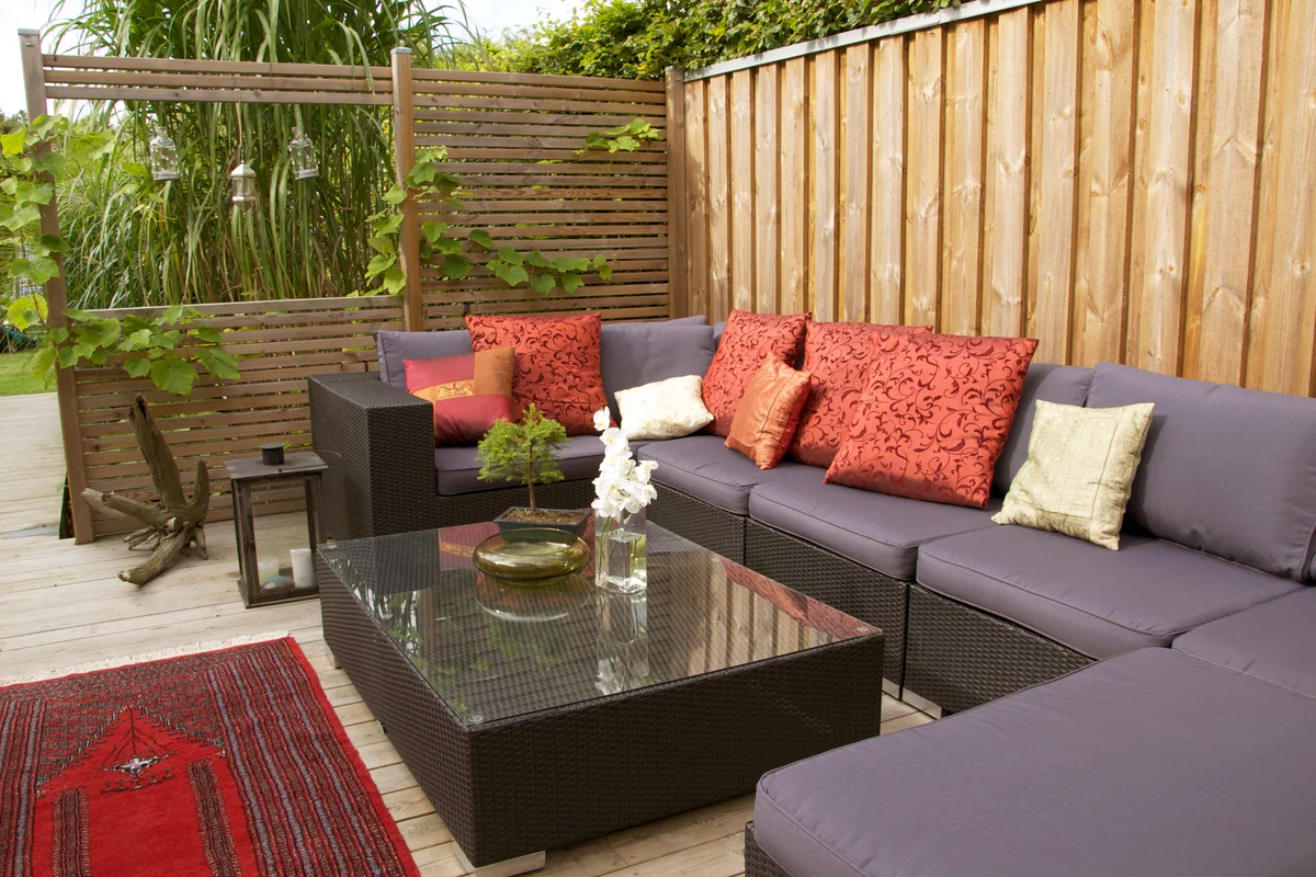 Contemporary patio with large wicker sofa