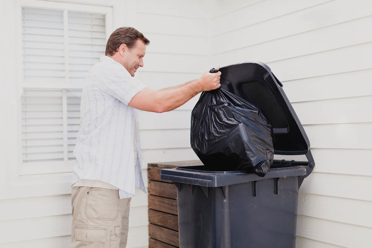 Man taking out garbage