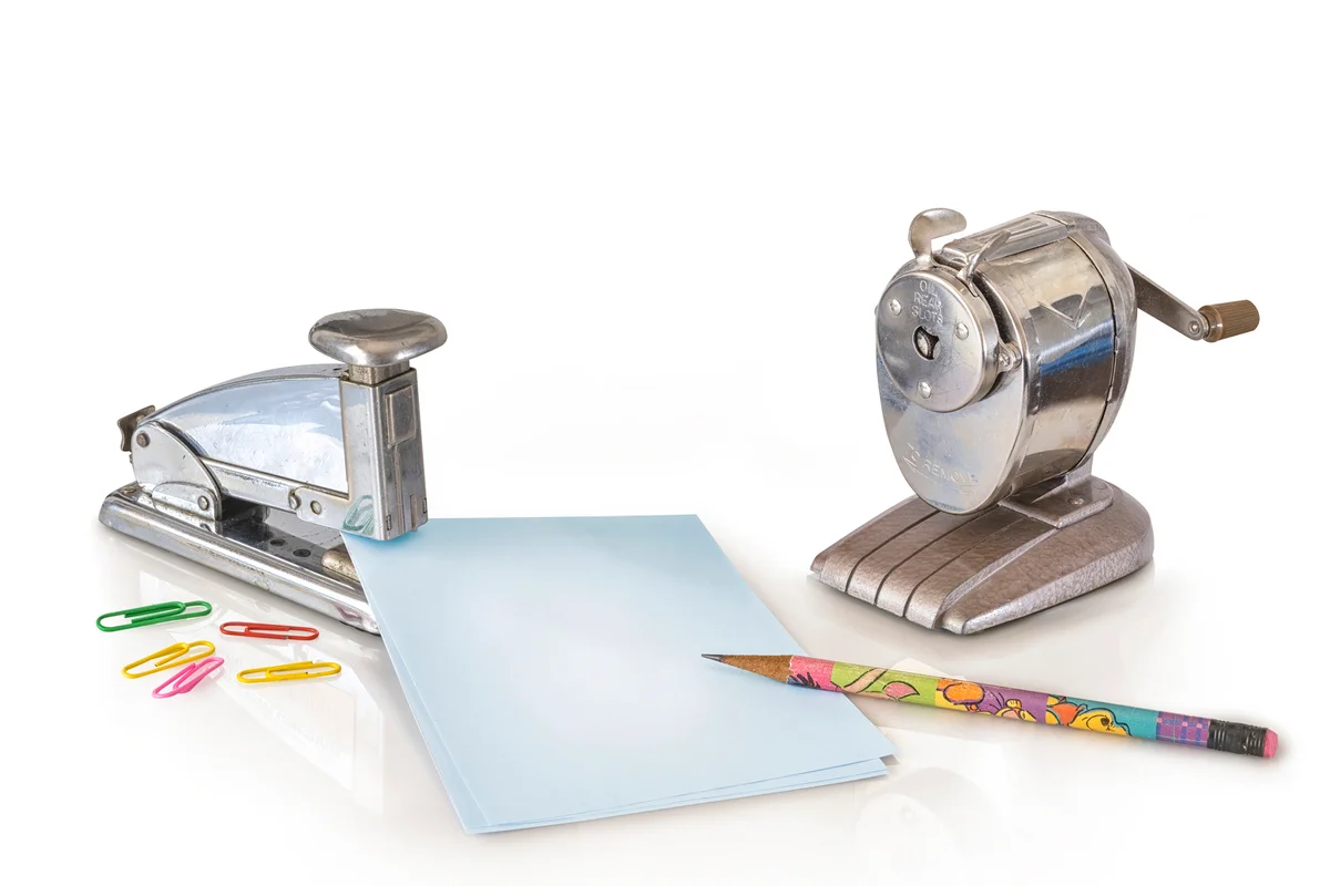 Old antique retro pencil sharpener and office supplies