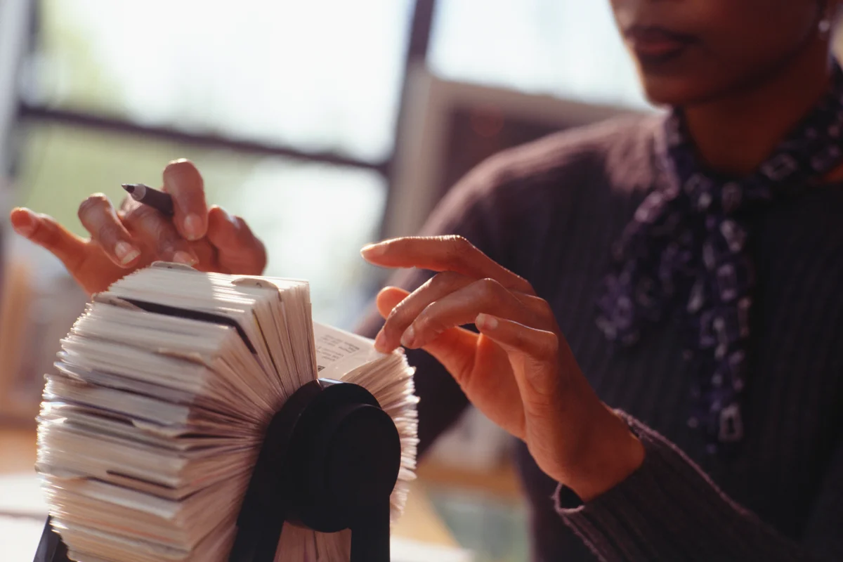 Businesswoman flicking through rolodex
