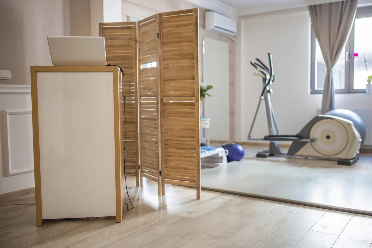Modern home gym with wooden divider