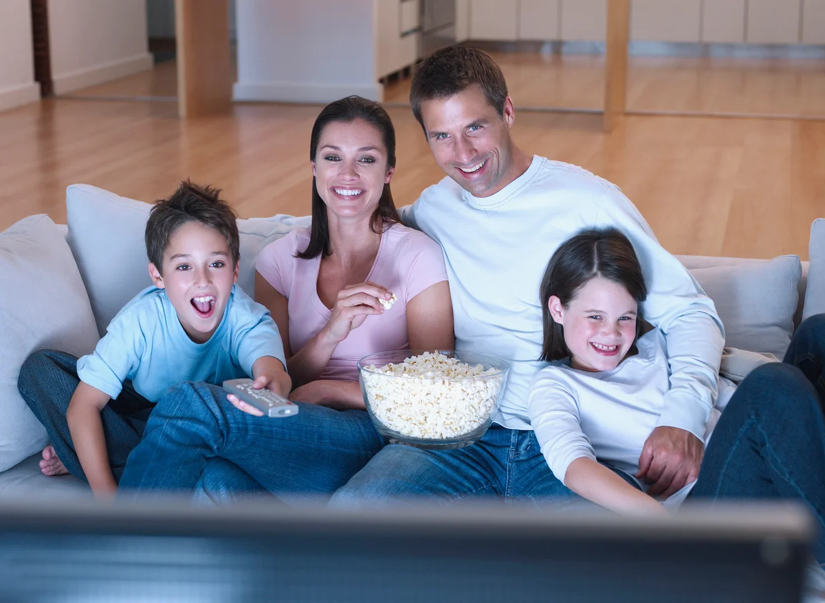 Family watching a movie