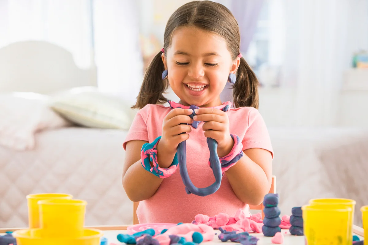 Girl playing with clay