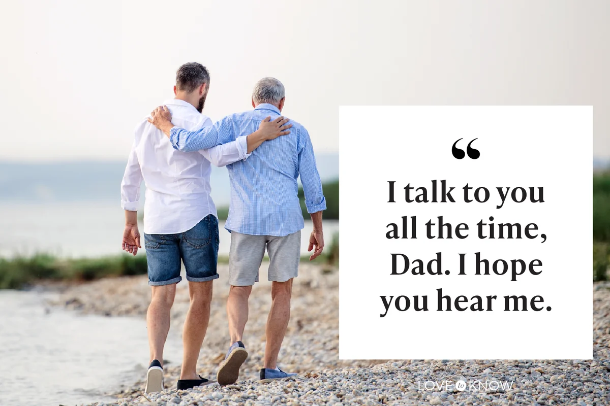 Father and adult son walking on the beach