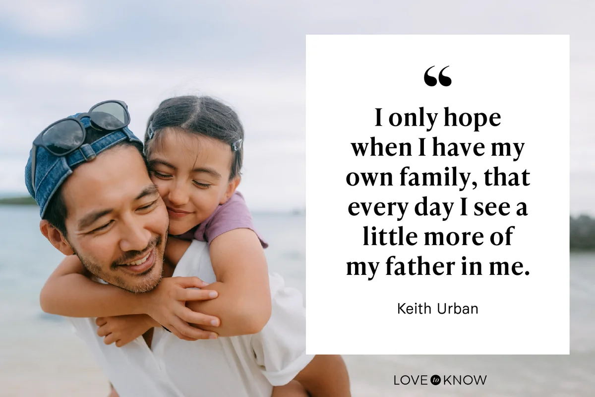 Father giving piggyback ride to young daughter on beach
