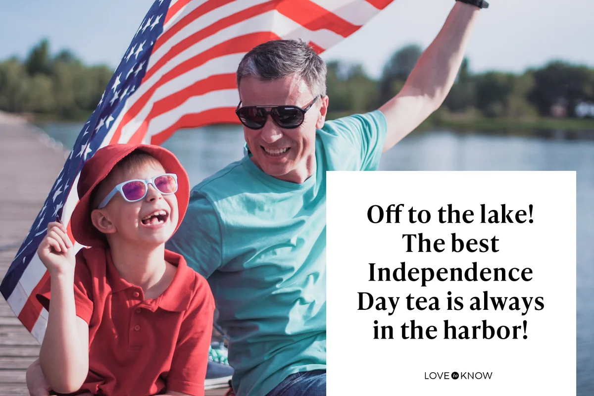 Father and son posing with American flag