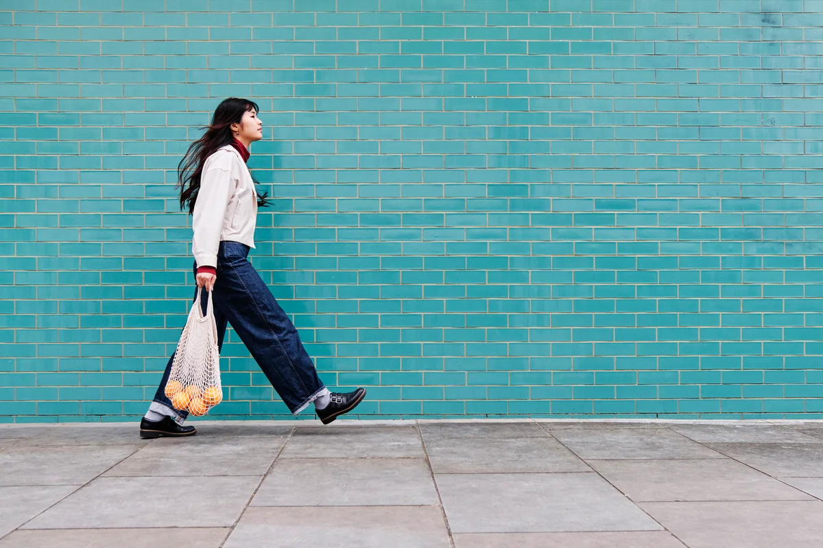 woman with a bag of fruit