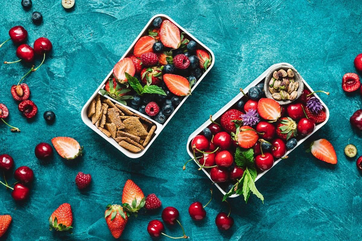 Two lunch boxes with healthy food