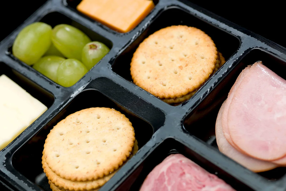 Plastic tray containing sliced honey ham