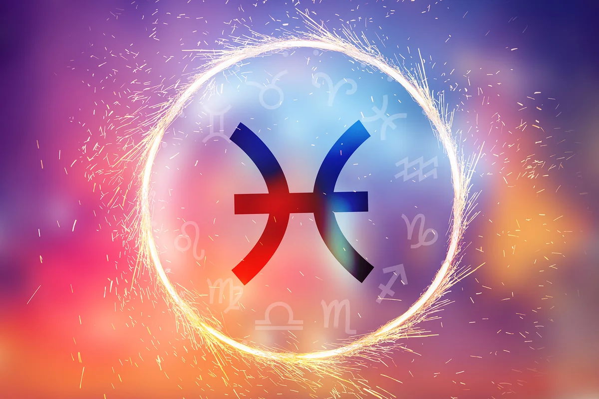 Pisces symbol on a colorful background light