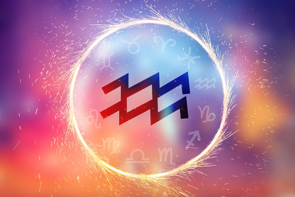 Aquarius symbol on a colorful background light