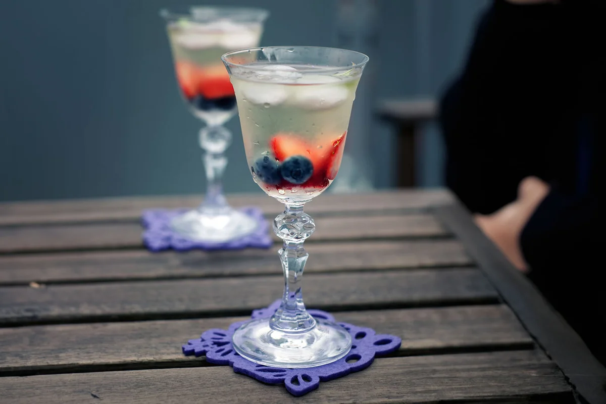 Chilled wine and fruits in glasses