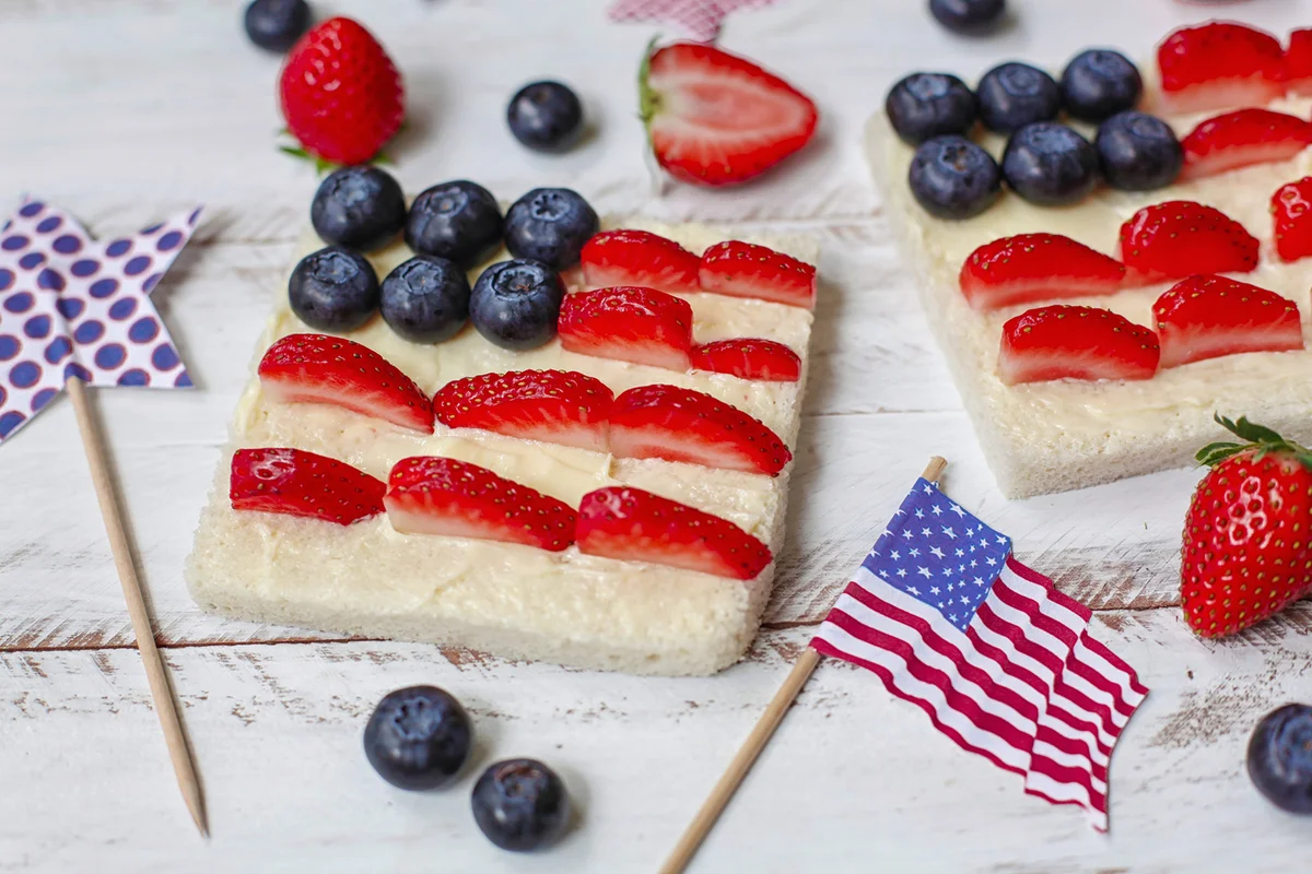 Toast with the American flag made with butter, blueberries and strawberries