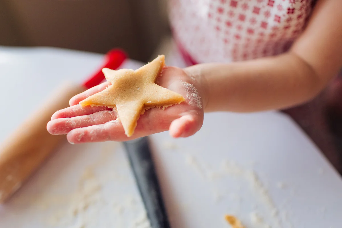 Girl showing star shaped cookie