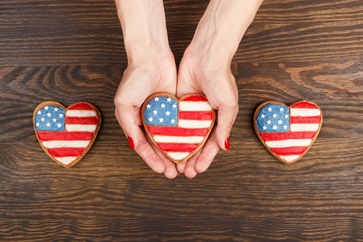 Cookie With American Patriotic Colors In The Hands