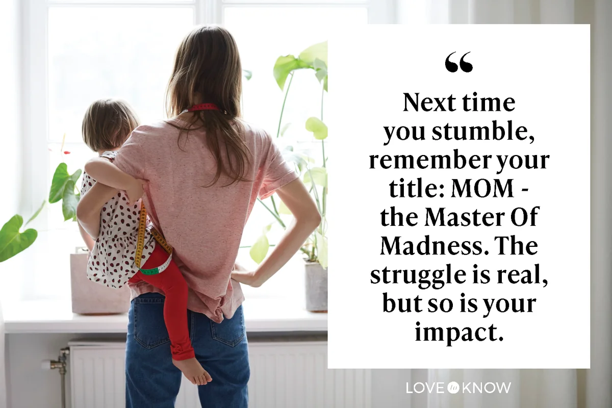 Mother carrying her daughter while standing at home