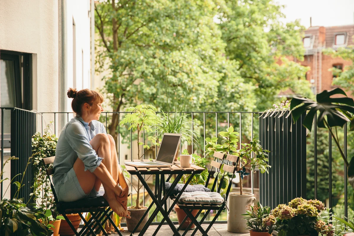 Woman smiling taking a break with laptop