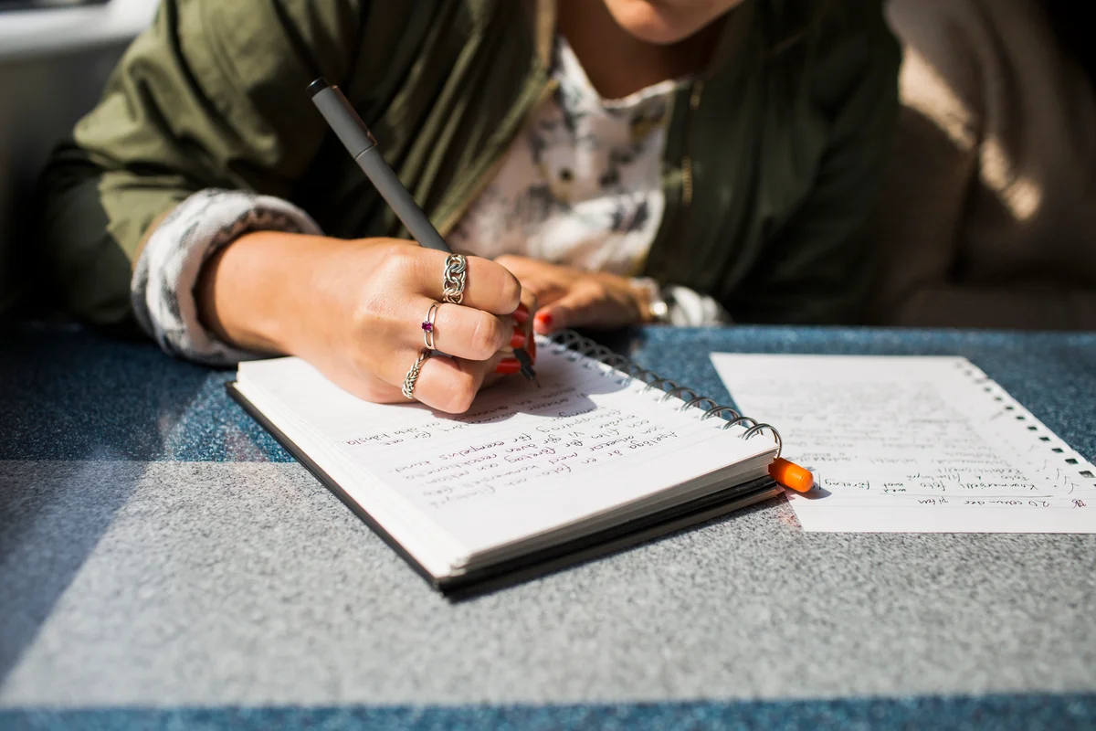 Woman writing in journal
