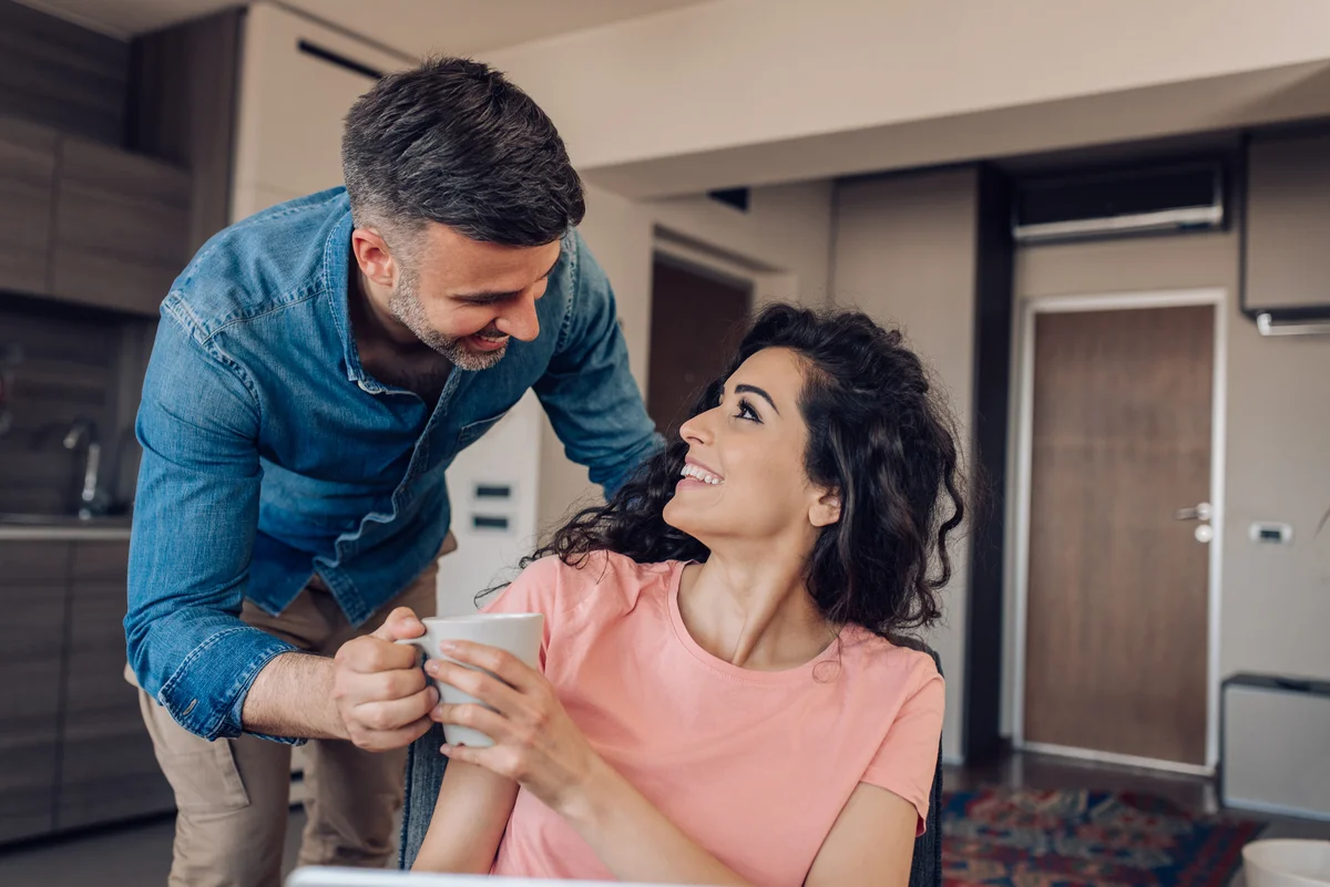 man bringing wife coffee