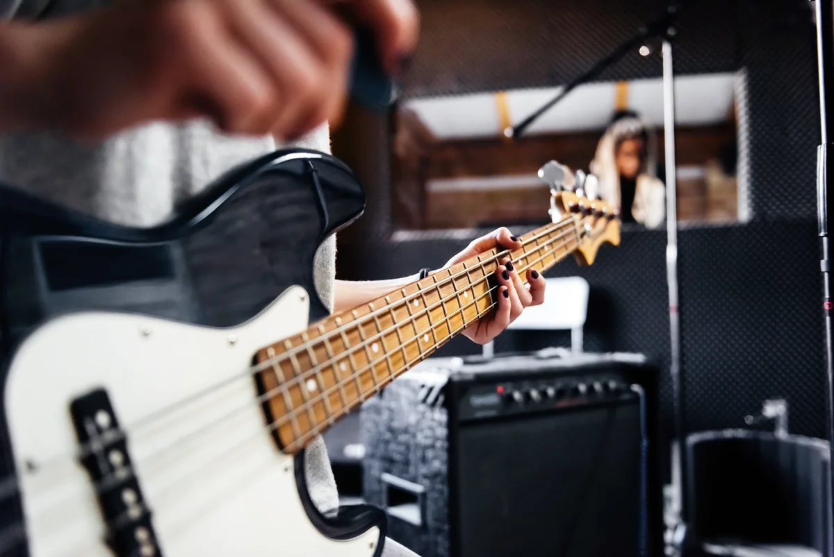 Musician playing bass guitar