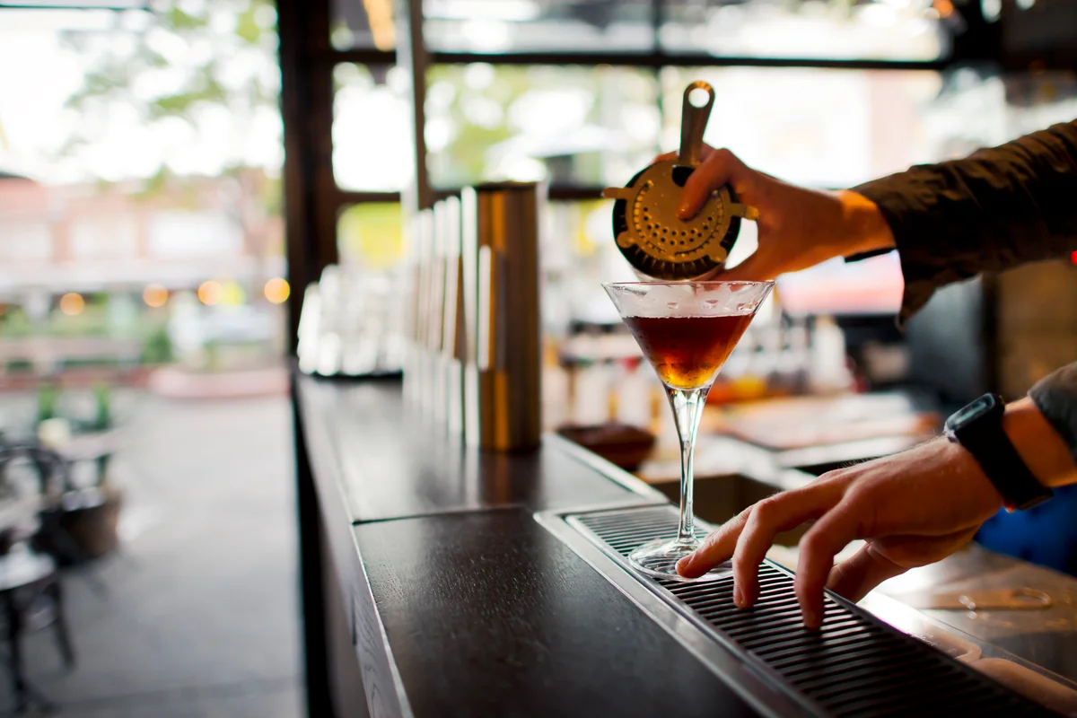 Straining a cocktail