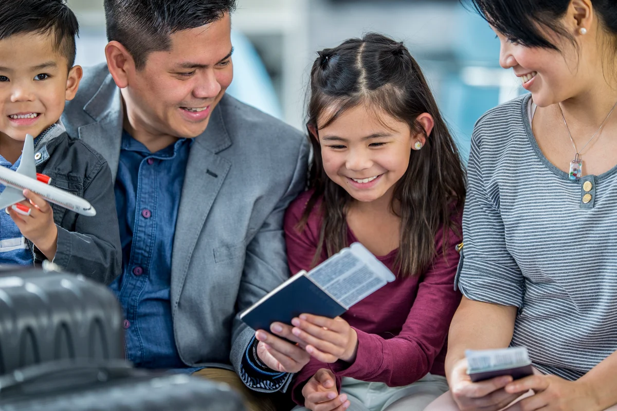 Family with passports at airport