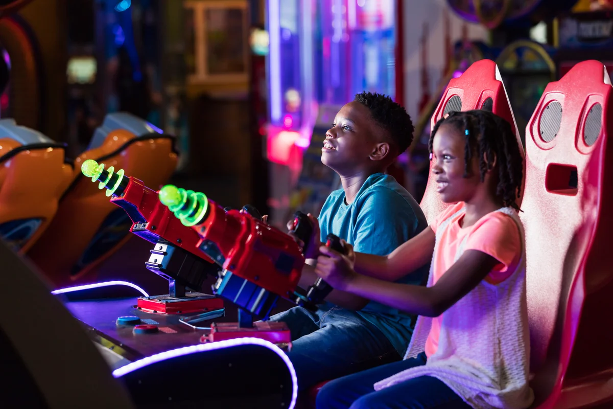 Kids playing games at arcade