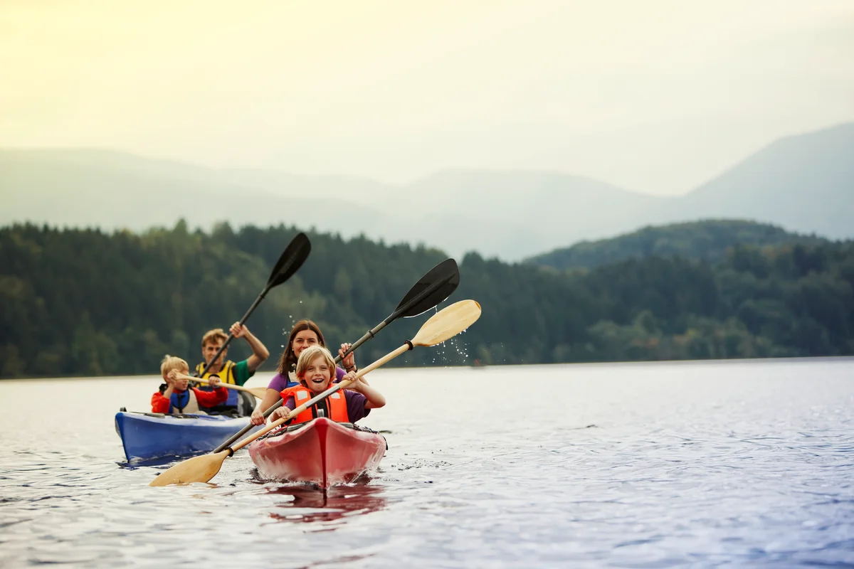 Family canoeing in lake