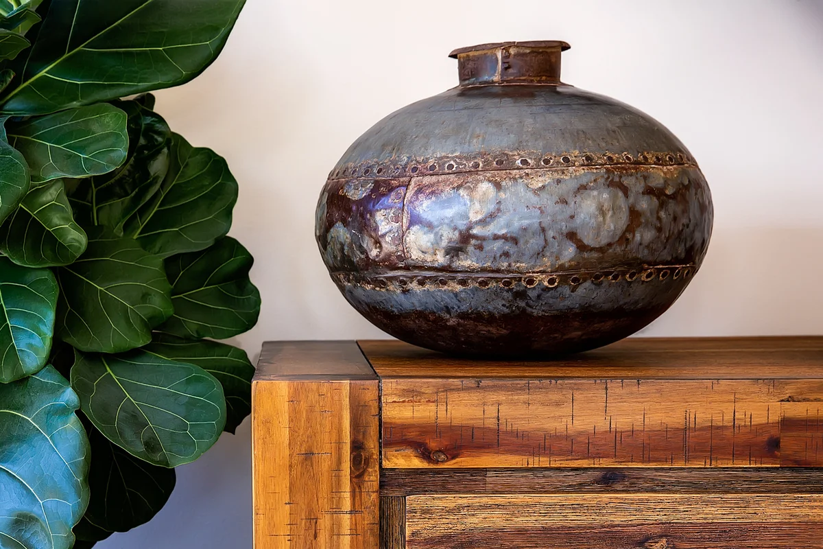 A decorative urn on a sideboard