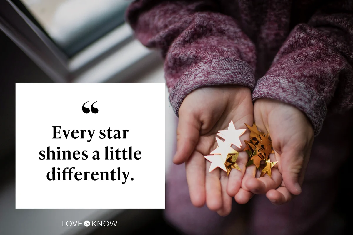 Cropped hands of girl holding star shape decorations