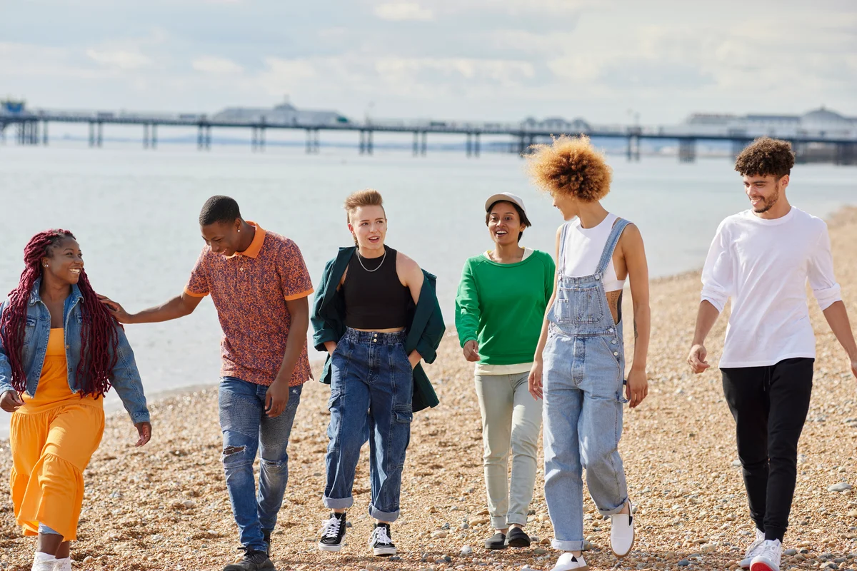 teens walking on the beach