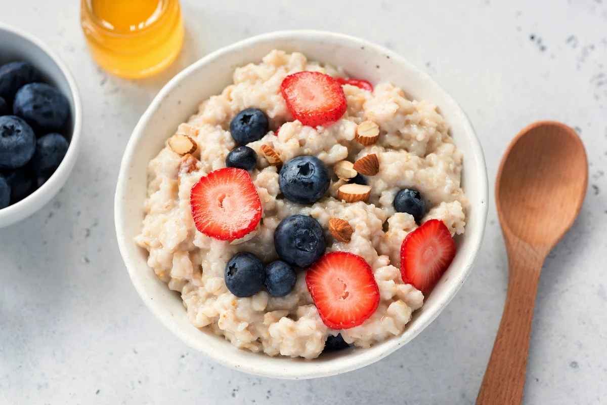 Oatmeal porridge with fresh berries in a bowl