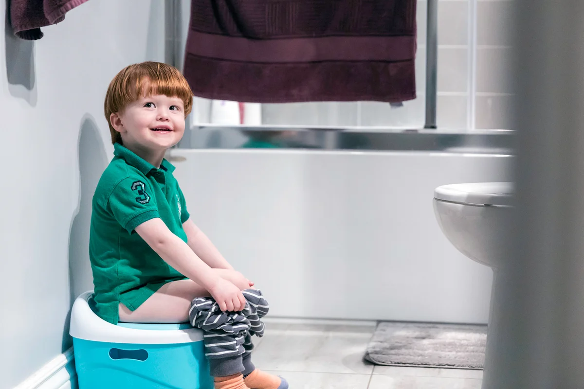 Happy Cute Redhead Little Boy Potty Training