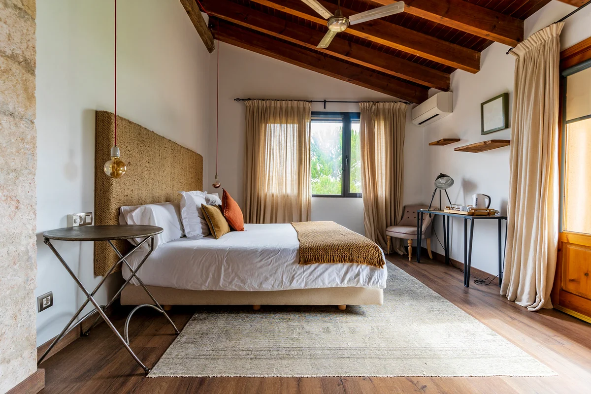 Interior of hotel room with bed and furniture
