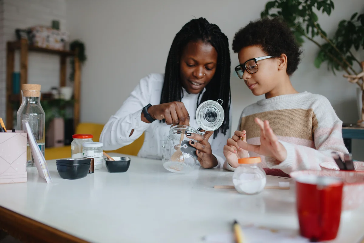Mother and child making baking soda air freshener