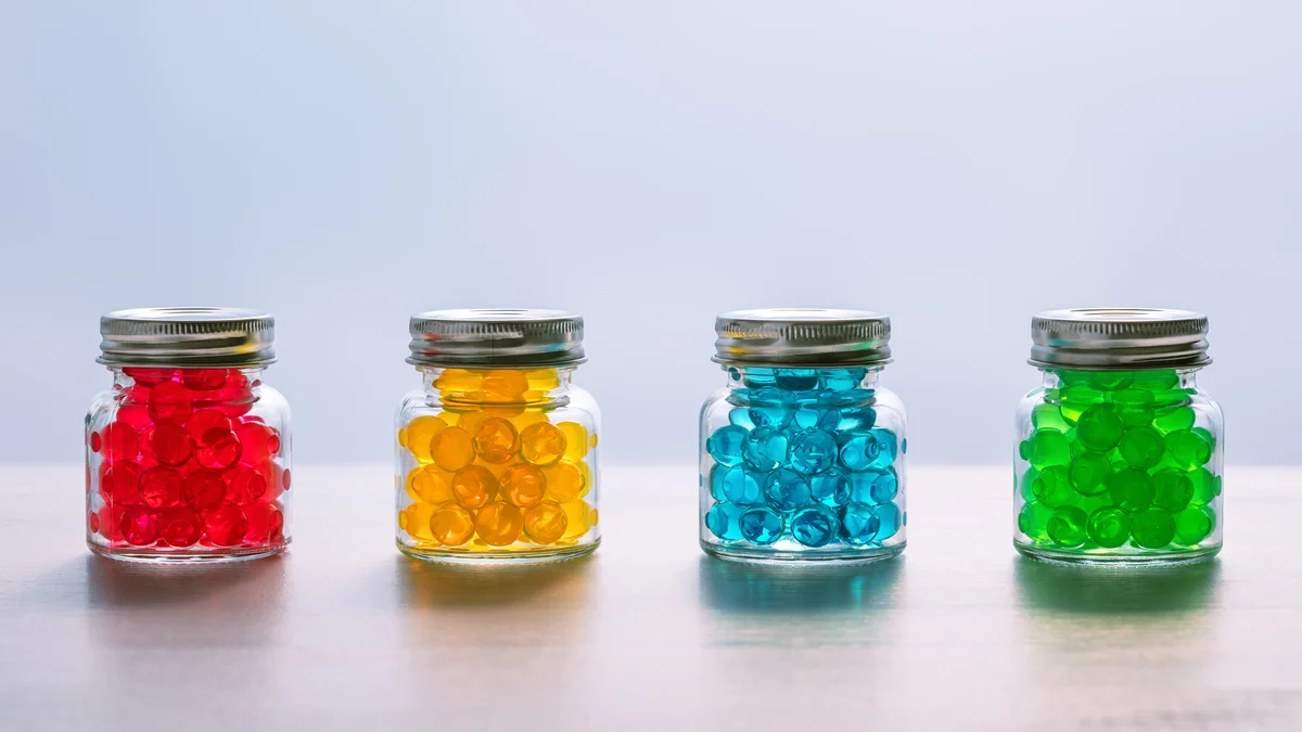 4 jars of of colored gel beads