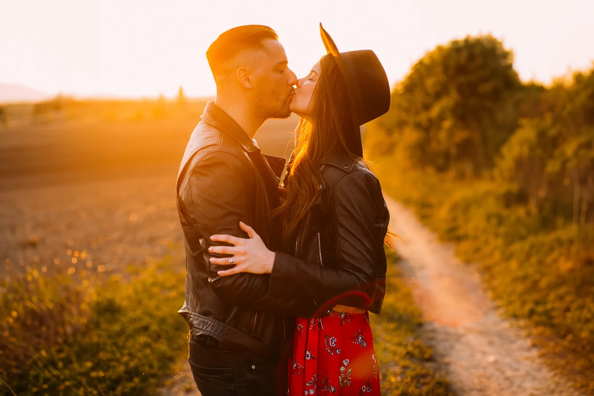 Couple kissing at sunset