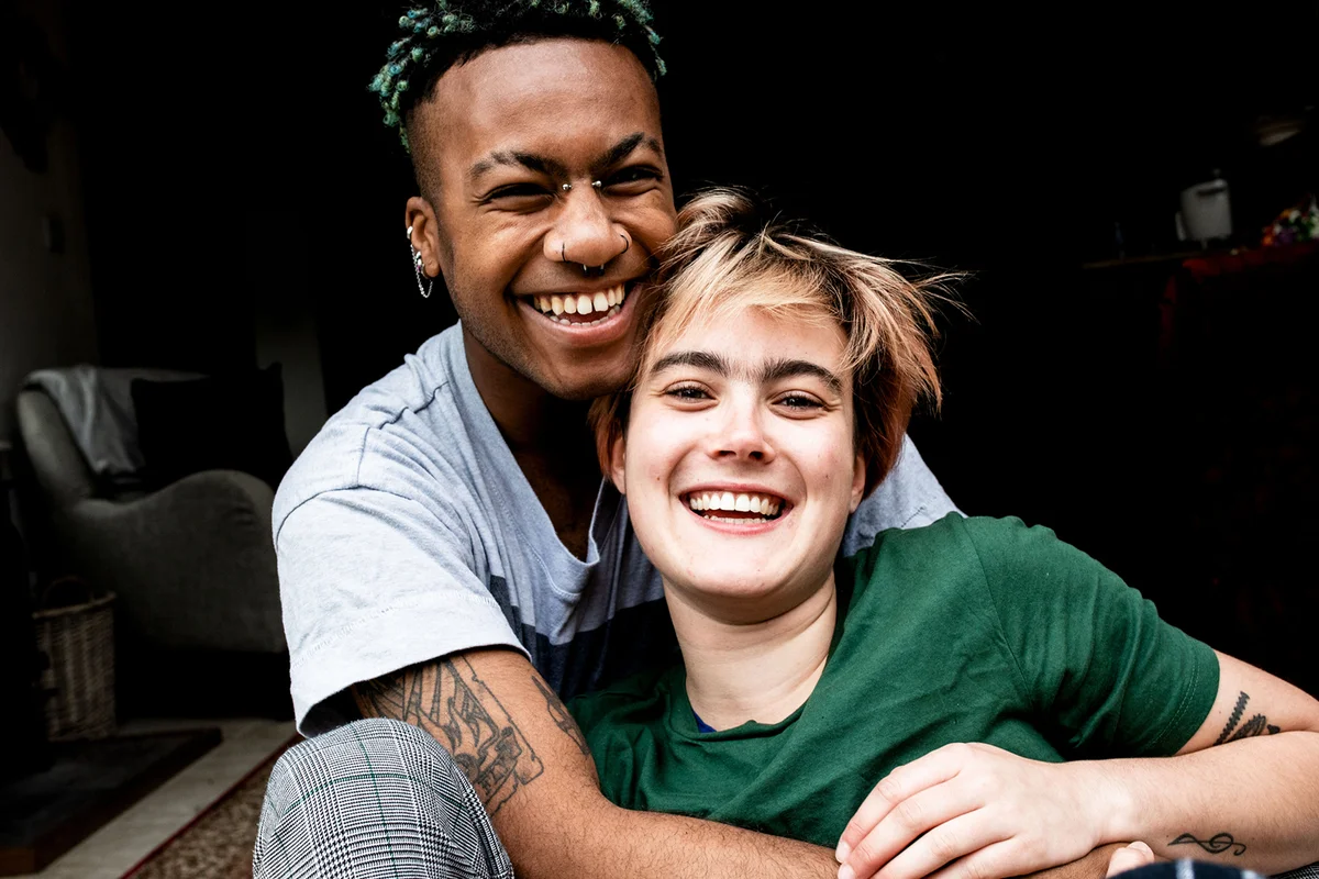 couple laughing and hugging