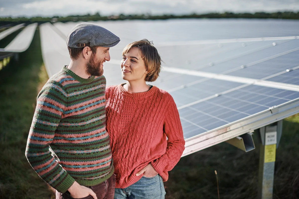 Portrait of farming couple in their solar farm