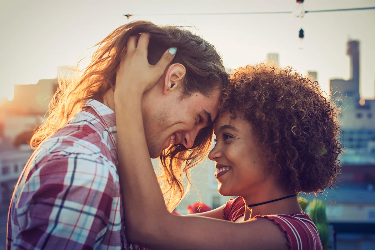 Couple embracing on urban rooftop