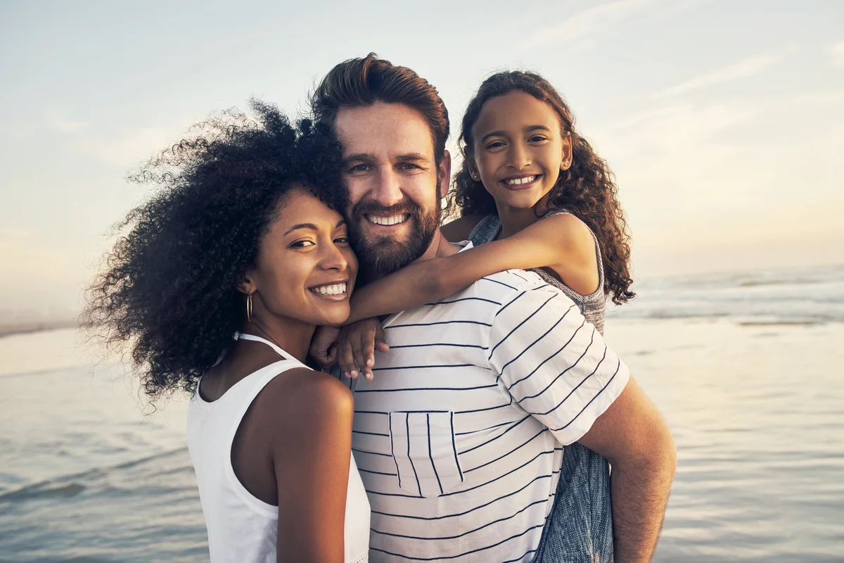 Happy family spending time at the beach