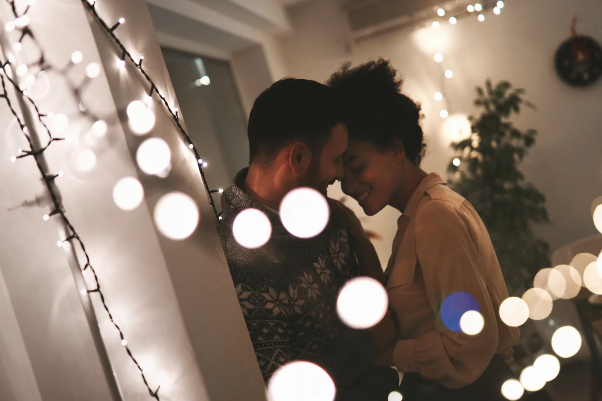 couple having romantic new year's celebration at their home