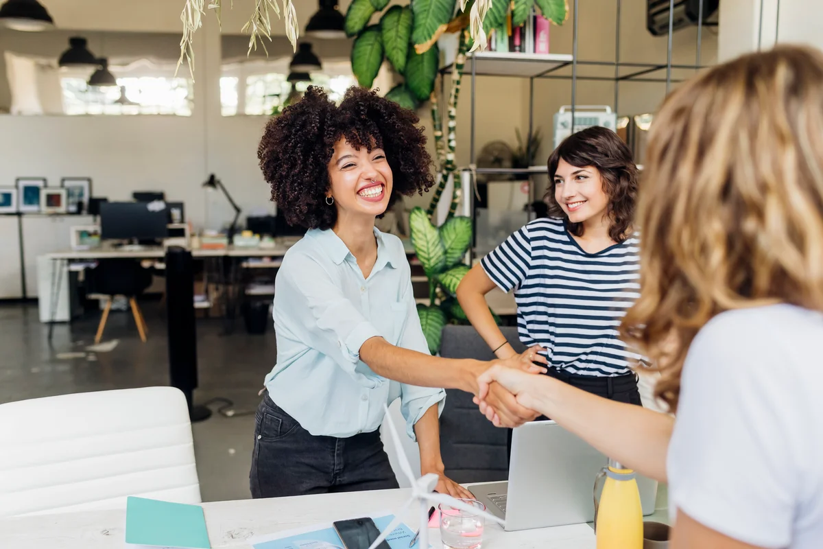 businesswomen shaking hands