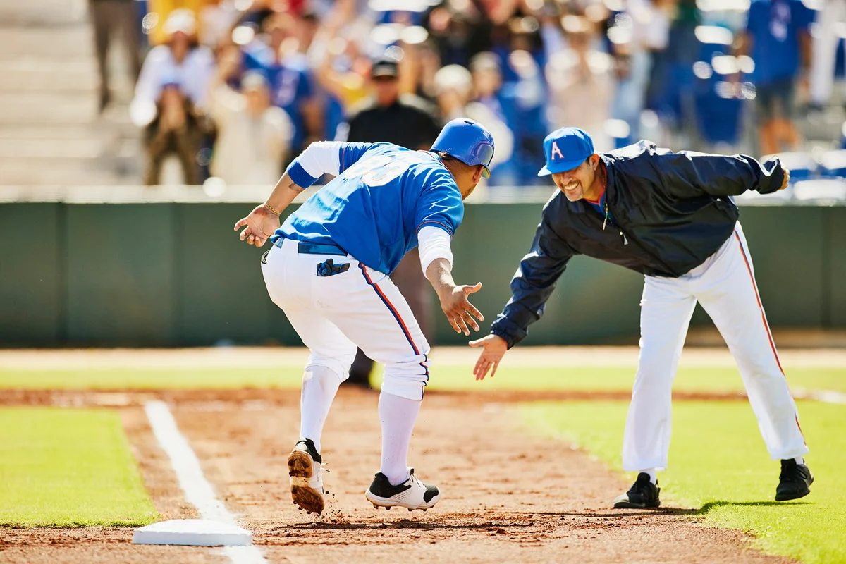 Wide shot batter celebrating after home run during baseball game
