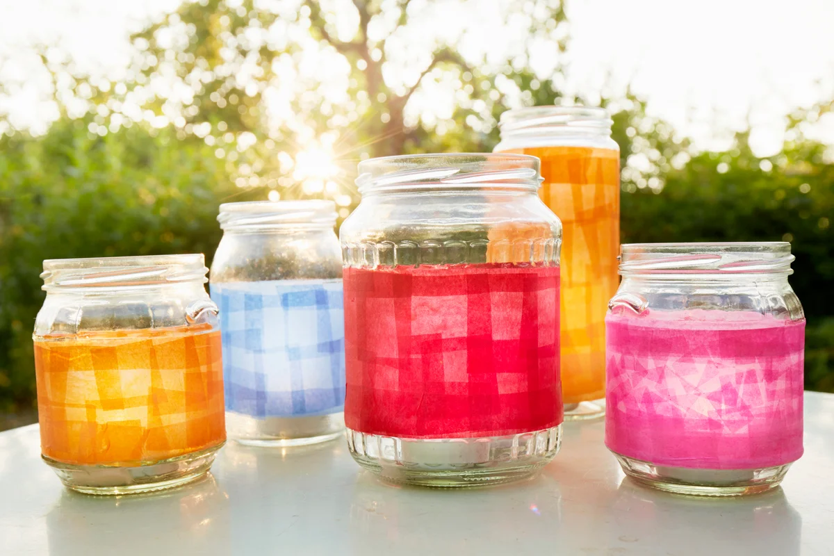 Mason jars covered with colored paper