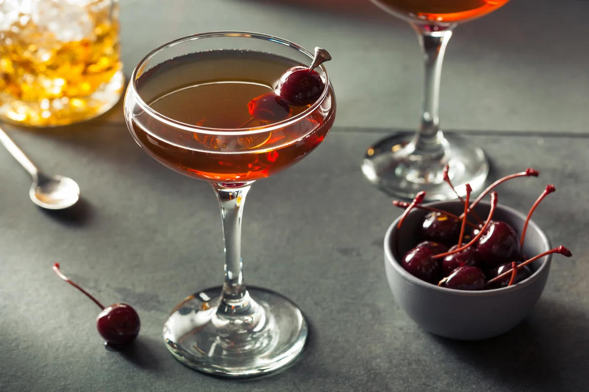 Homemade Rye Bourbon Manhattan with a Cherry Garnish