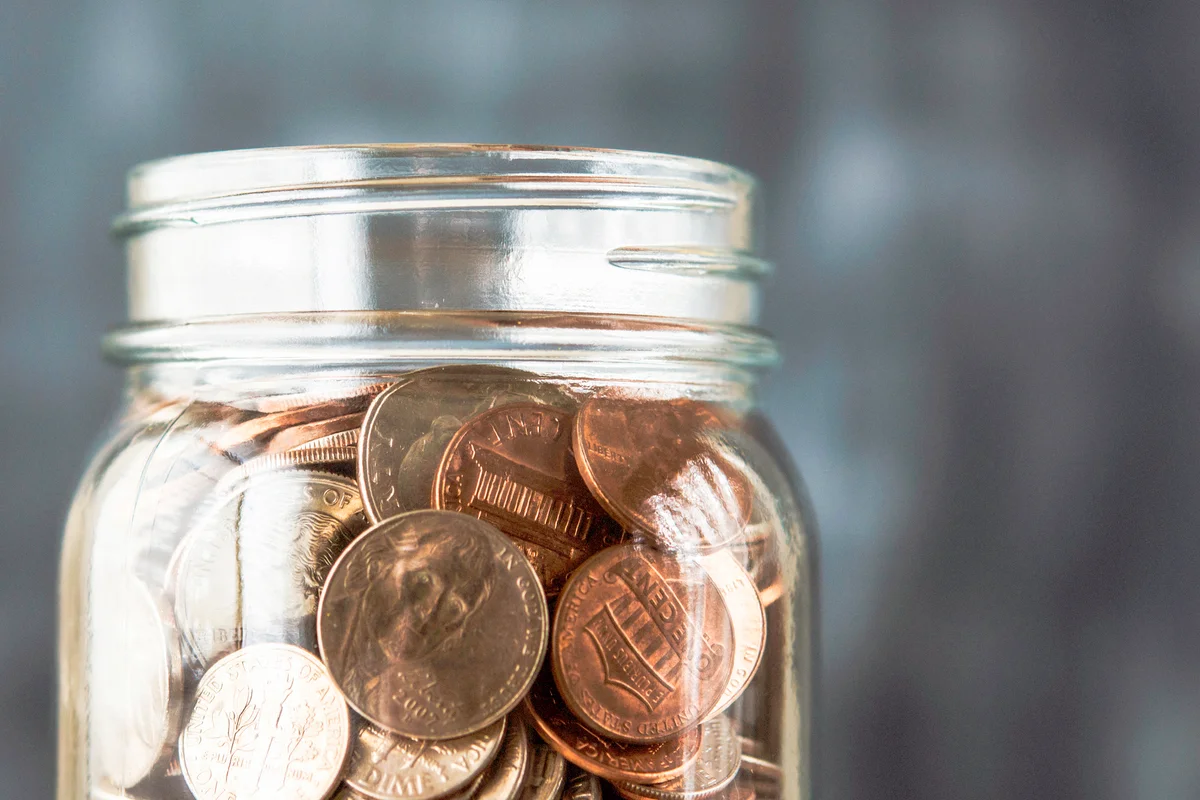 Glass jar filled with American coins