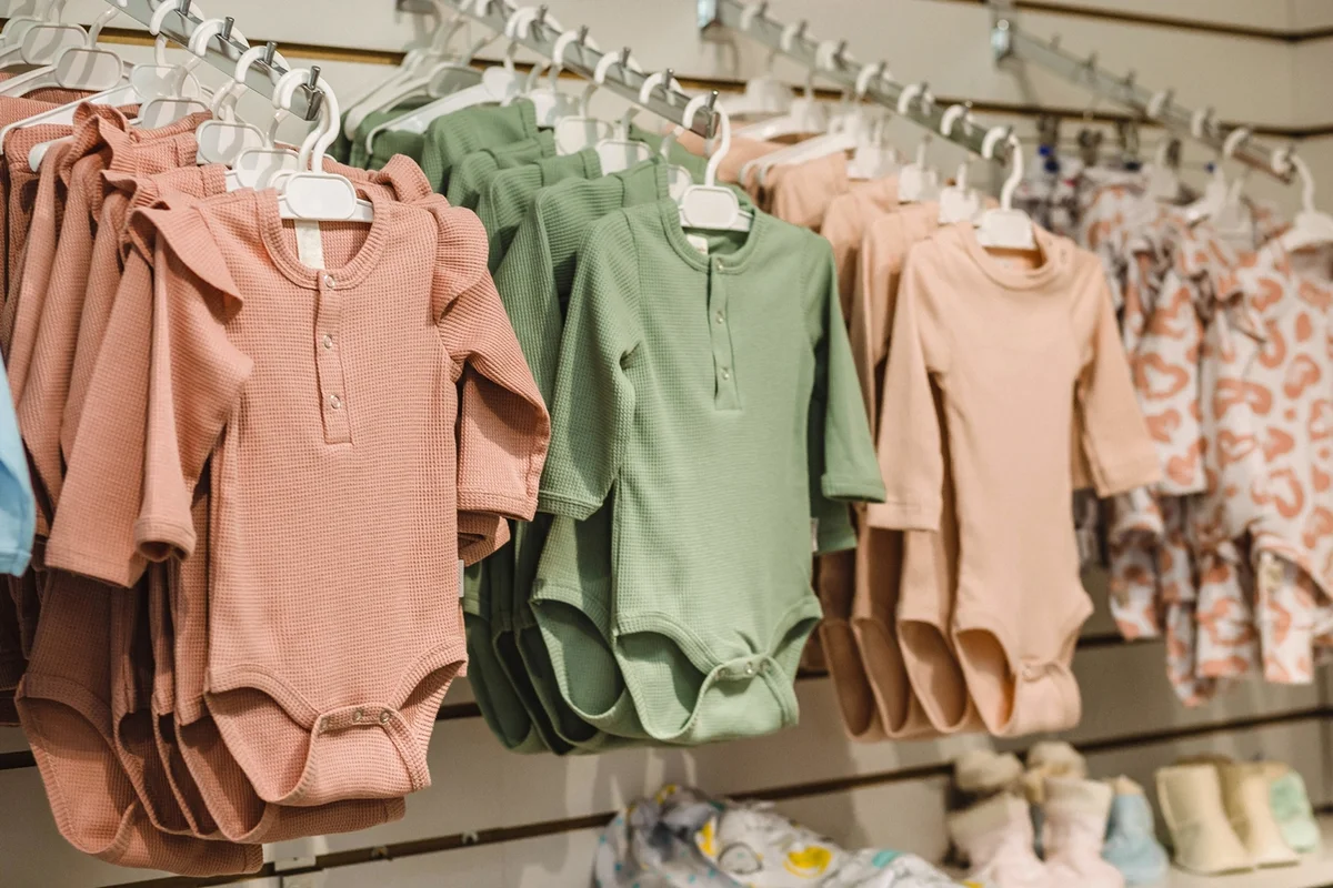 Children's things hang on a hanger in a clothing store