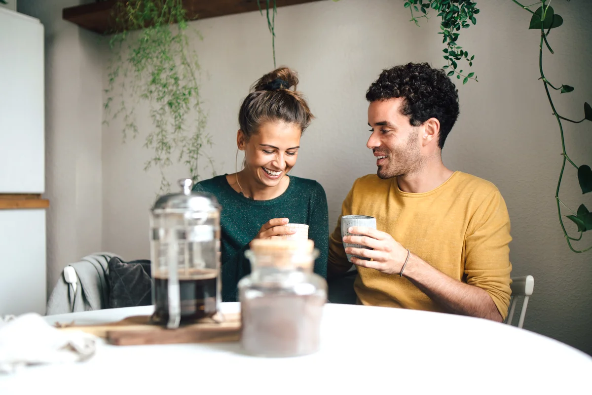 Couple having coffee at home