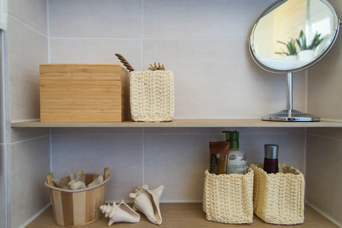 baskets on shelves in bathroom